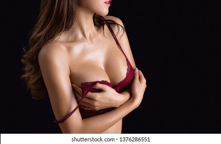 Beautiful slim body of woman in studio. Isolated on black background