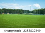 Beautiful small football training ground located among pine forests. Jacnia, Poland