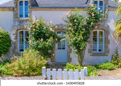 Beautiful Small House In Brittany, Typical Home With Rosebush And A Wooden Gate
