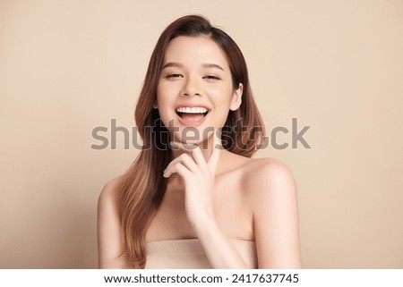 Beautiful smile of young asian woman with healthy white teeth on beige background, Dental care. Dentistry concept.