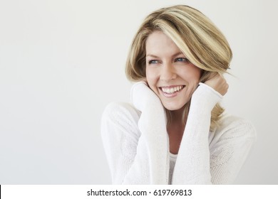 Beautiful smiling blond woman, studio