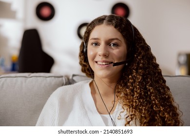 Beautiful Smiling Brunette Woman With Curls Working On A Hotline, Office Claims. Looking Into Camera