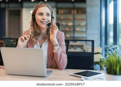 Beautiful smiling call center worker in headphones is working at modern office. - Powered by Shutterstock