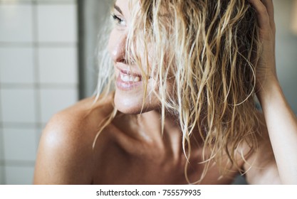 Beautiful Smiling Caucasian Woman Posing With Wet Hair At Bathroom After Shower.