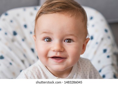Beautiful smiling cute baby. Beautiful expressive adorable happy cute laughing smiling baby infant face. Children, people, infancy and age concept - beautiful happy baby 