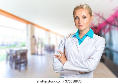 Beautiful Smiling Doctor Woman In Medical Gown