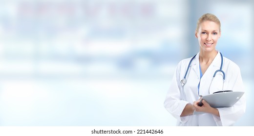 Beautiful Smiling Doctor Woman Over Blue Hospital Background