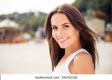 Beautiful smiling girl enjoying  warm summer weather