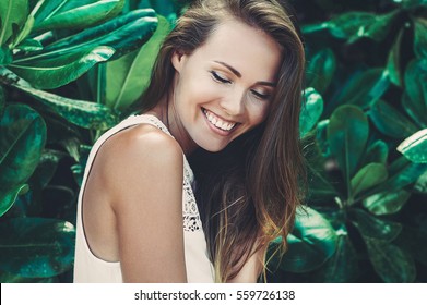 Beautiful smiling girl with eyes closed