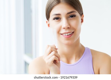 Beautiful Smiling Girl Holding Teeth Whitening Strip