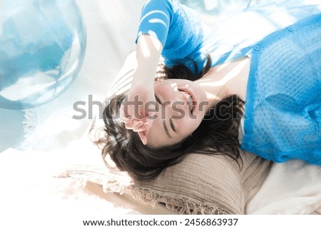 Similar – Image, Stock Photo Portrait of beautiful dark haired European woman has healthy glowing skin, make up, dressed in casual checkered shirt, looks directly at camera, stands against blue background, being in good mood