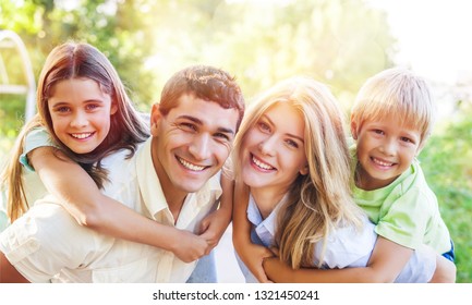 Beautiful Smiling Lovely Family On Background