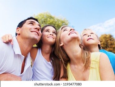 Beautiful smiling Lovely family in park - Shutterstock ID 1193477080