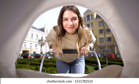 Beautiful Smiling Mother Admiring Baby Swinging Stroller, Motherhood Infant Pov