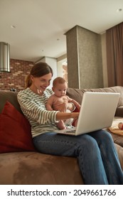 Beautiful Smiling Mother During Videocall With Her Husband Holding Cute Infant Baby, Showing Something On Screen. Staying In Touch With Missing Family Member With Help Of Gadgets.