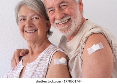 Beautiful smiling senior couple 70s after receiving the booster coronavirus covid-19 vaccine. - Powered by Shutterstock