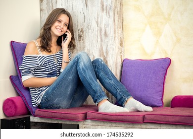 Beautiful  Smiling Teen Girl Talking On The Phone