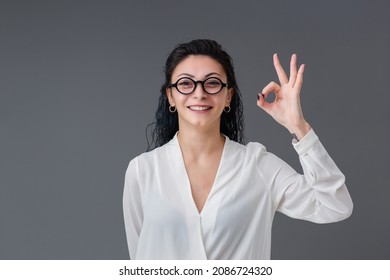 Beautiful Smiling Turkish Young Woman Portrait. She Wears A Stylish Eyeglasess, She Is Happy And Thumbs Up. Copy Space Includes.