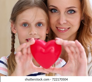 Beautiful Smiling Woman And Kid Hold Red Toy Heart In Arms Portrait. Female Give Birth To Life, Palm Hug, Diagnosis Aid, Healthy Pregnancy, Feel Peace, Donation Service, Souls Together, Abortion