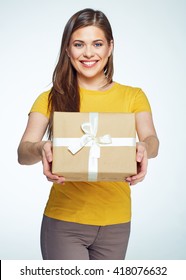 Beautiful Smiling Woman With Long Hair Holding Gift Box. White Background Isolated Studio Portrait.