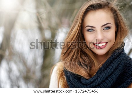 Beautiful smiling woman winter portrait	
