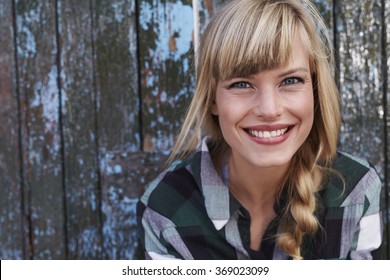 Beautiful smiling young blond woman, portrait - Powered by Shutterstock