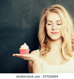 Beautiful Smiling Young Woman With A Cake