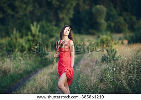 Similar – Foto Bild Rot gekleidete Frau, die im Wald meditiert.