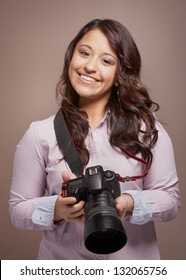 Beautiful Smiling Young Woman Photographer With Camera