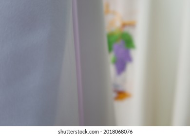 Beautiful And Smooth Bright Clothe Is Hanging In A Low Light Room.