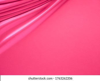 Beautiful Smooth Elegant Wavy Hot Baby Pink Satin Silk Luxury Cloth Fabric Texture, Abstract Background Design. Copy Space. Banner