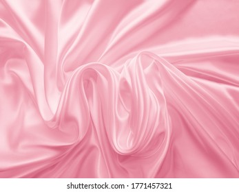 Beautiful Smooth Elegant Wavy Hot Baby Pink Satin Silk Luxury Cloth Fabric Texture, Abstract Background Design. Copy Space