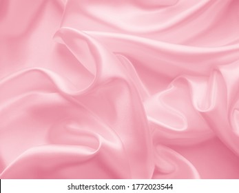 Beautiful Smooth Elegant Wavy Hot Baby Pink Satin Silk Luxury Cloth Fabric Texture, Abstract Background Design. Copy Space