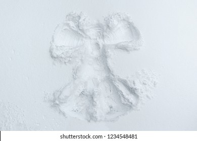 A Beautiful Snow Angel Made By A Child On Snow-white Snow.