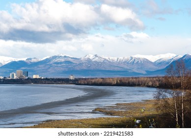 Beautiful Snow Cap Chugach Mountain And Downtown Anchorage From Kincaid Park. Aerial View Coastal Trail Along Cook Inlet, Turnagain Arm  With Buildings Skyscraper