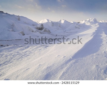 Beautiful snow dunes.Landscape blue ridges.