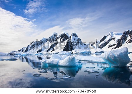 Beautiful snow-capped mountains against the blue sky in Antarctica