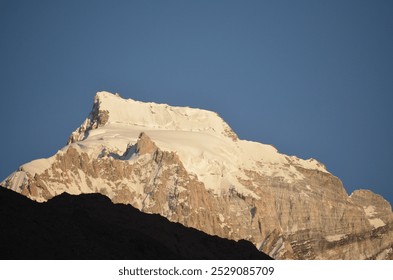 Beautiful snow-covered Mountain peak with a blue sky. Mountain close-up photo. Mountains of Pakistan.  - Powered by Shutterstock