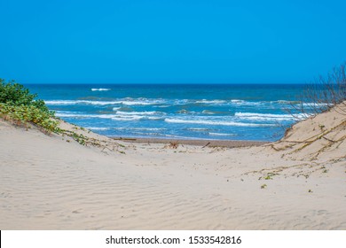 A beautiful soft and fine sandy beach along the gulf coast of South Padre Island, Texas