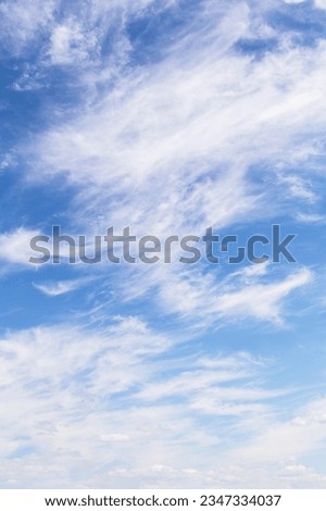 Beautiful soft gentle cloudy blue sky with white cirrus clouds, abstract background texture