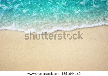 Beautiful Soft Turquoise ocean wave on Fine sandy beach Summer Background Concept