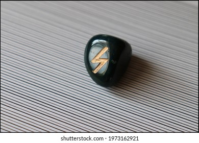 Beautiful Sowillo Rune made of Bloodstone with interesting background