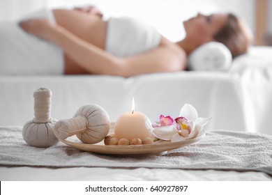 Beautiful spa composition and blurred pregnant woman on background - Powered by Shutterstock