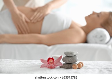 Beautiful spa composition and blurred pregnant woman on background