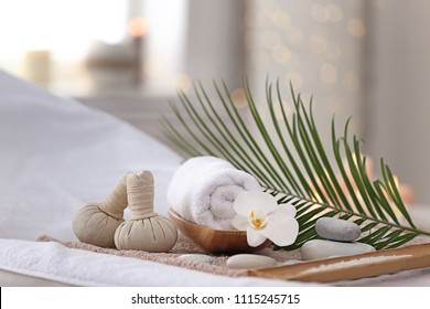 Beautiful spa composition on massage table in wellness center - Powered by Shutterstock