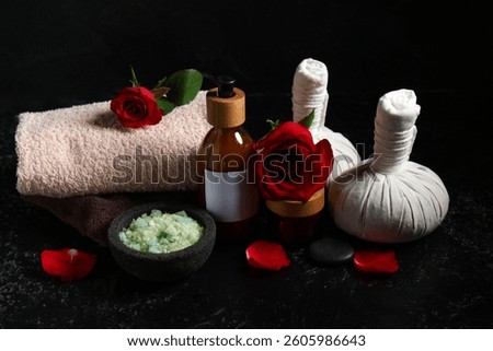 Beautiful spa composition with red rose flowers on dark background. Valentine's Day celebration