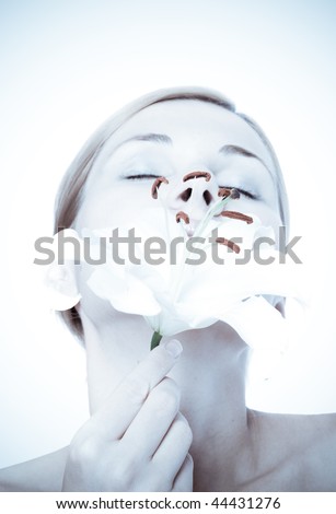 Similar – half of a girl’s face with a white lily and closed eyes