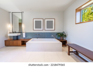 beautiful spacious white and blue bathroom with square freestanding bathtub mosaic tile wall mounted sinks glass shower stall and marble floors - Powered by Shutterstock