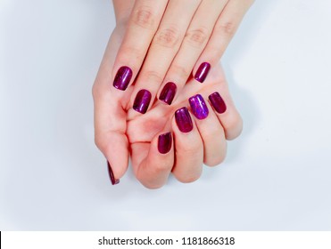 Beautiful Sparkling purple glitter gel nail art on fashionista woman fingernail.Hygienic hand spa manicure.professional beautician work