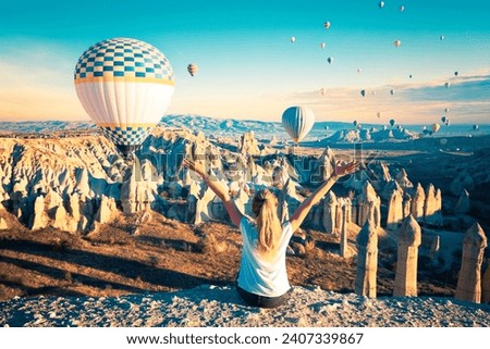 Beautiful spectable of hot air balloons flying in the air over Cappadocia- Travel destination, adventure, tour tourism concept